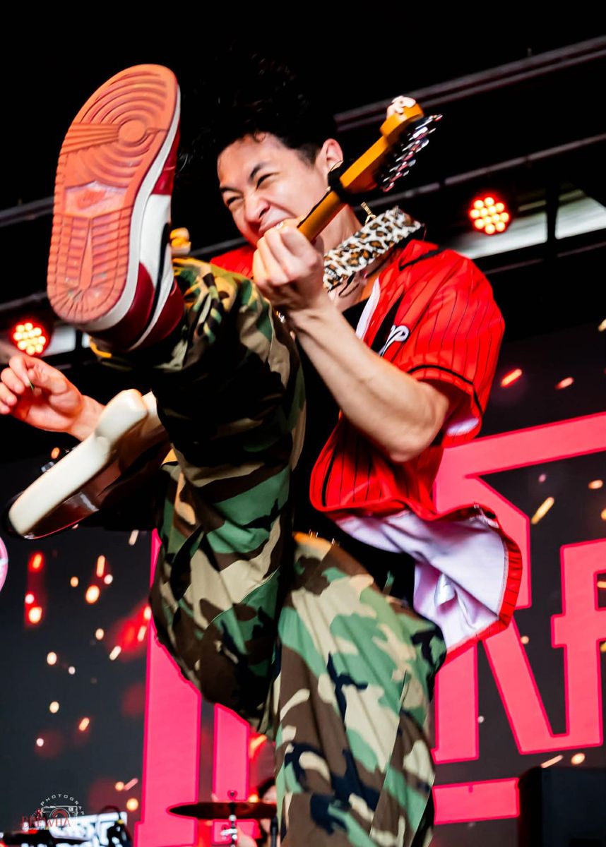 Ty mid-jump with his guitar